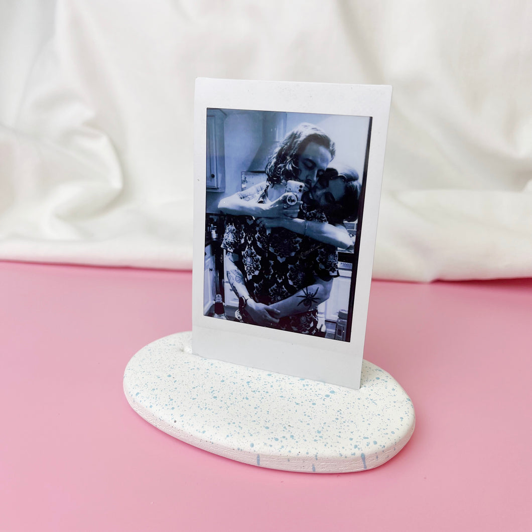 WHITE AND ICE BLUE POLAROID STAND